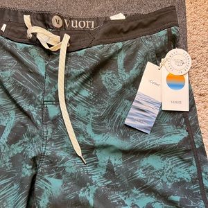 Vuori green floral board shorts